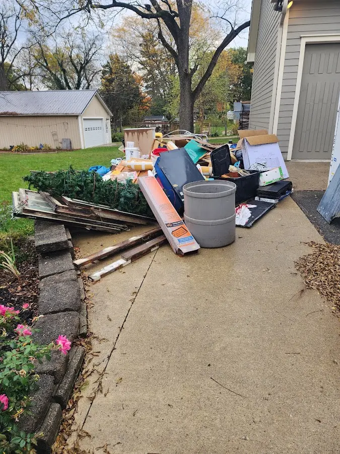 Dumpster being loaded with debris for 30 Yard Dumpster Rental in Butler